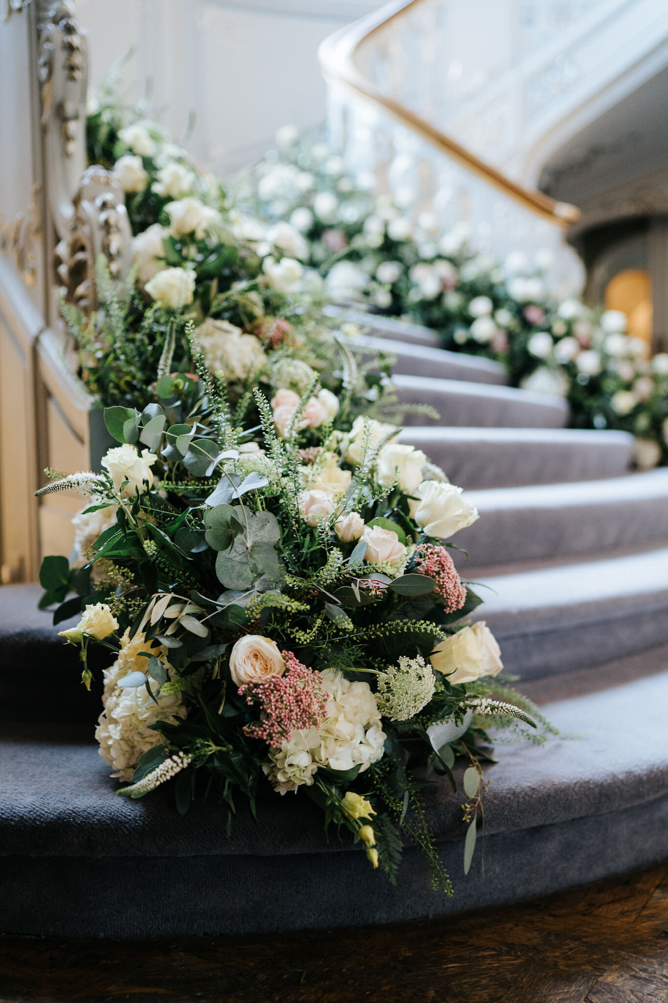 Staircase at Savile Club London covered in beautiful flowers