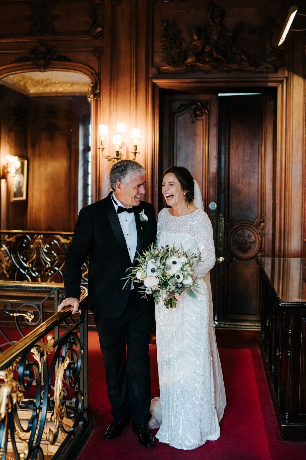 Bride and father of the bride share a special moment during Savile Club London wedding preparations
