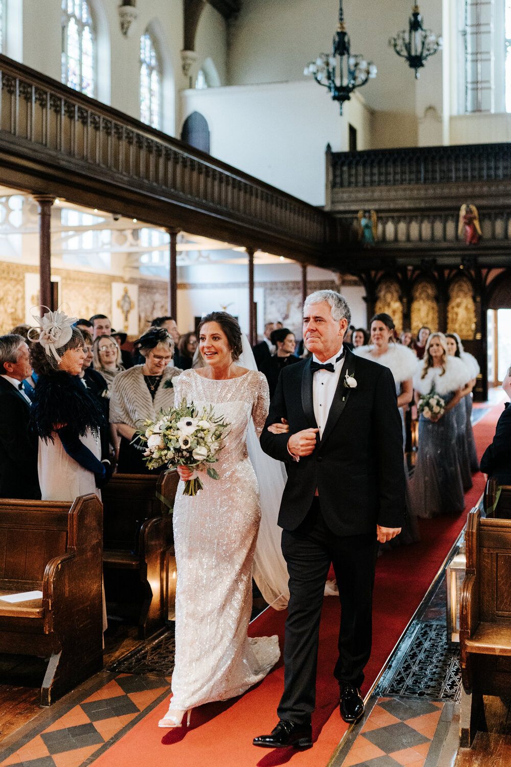 Bride and father of the bride walk down the aisle during St Pauls Knightsbridge wedding
