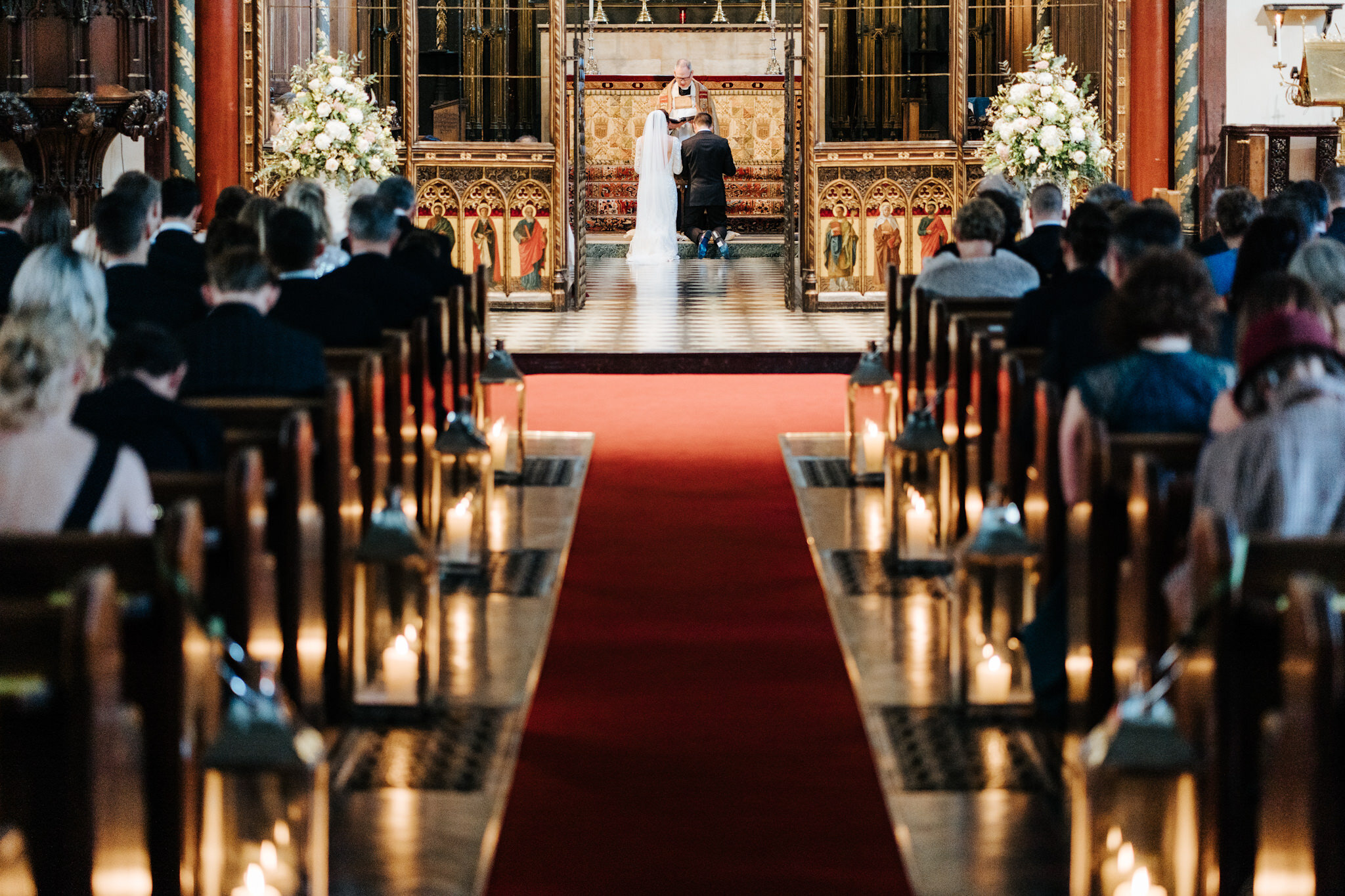 Wide photograph of the wedding ceremony at St Pauls Knightsbridge taken from the last pew