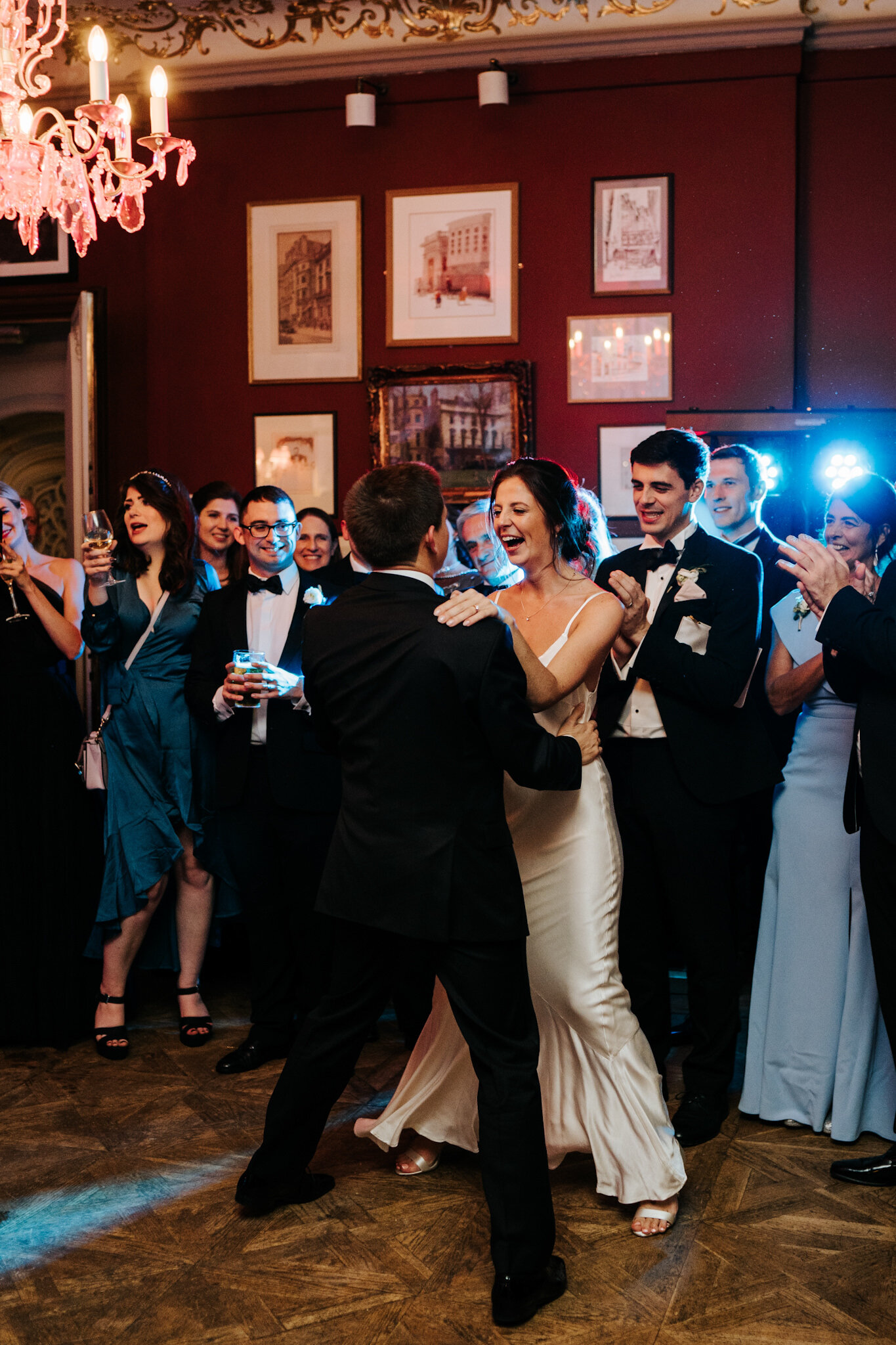 Bride and groom do their first dance as bride wears second dress of the day