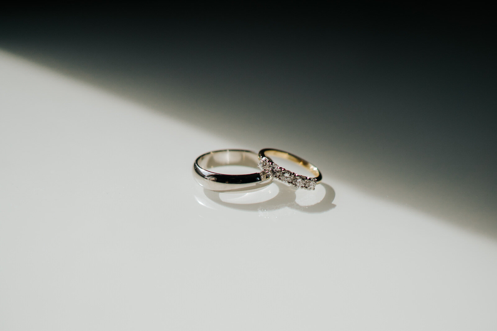 Close-up photograph of wedding rings before Richmond, Pembroke Lodge summer wedding