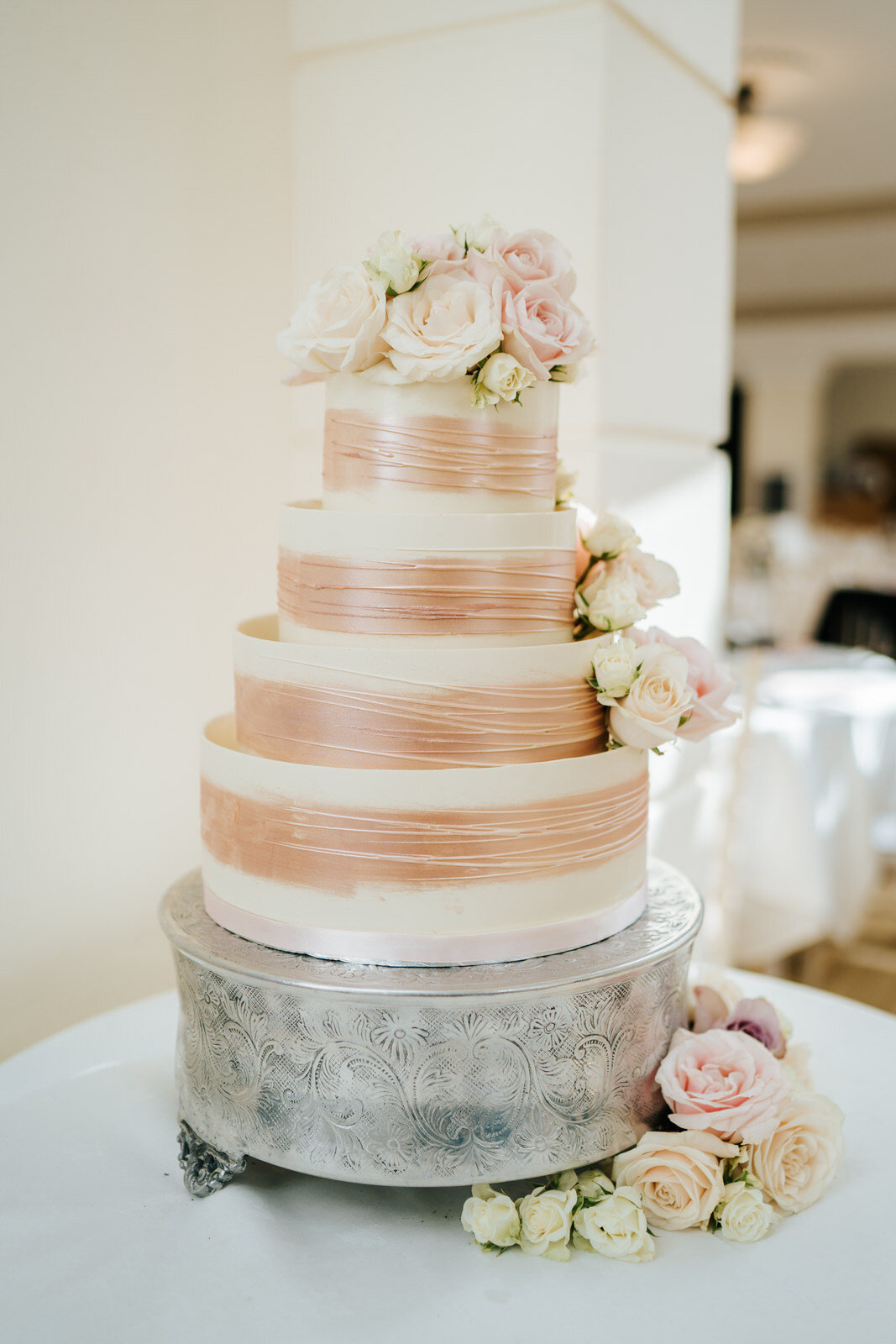 Photograph of the bride and groom's wedding cake at Pembroke Lodge in Richmond