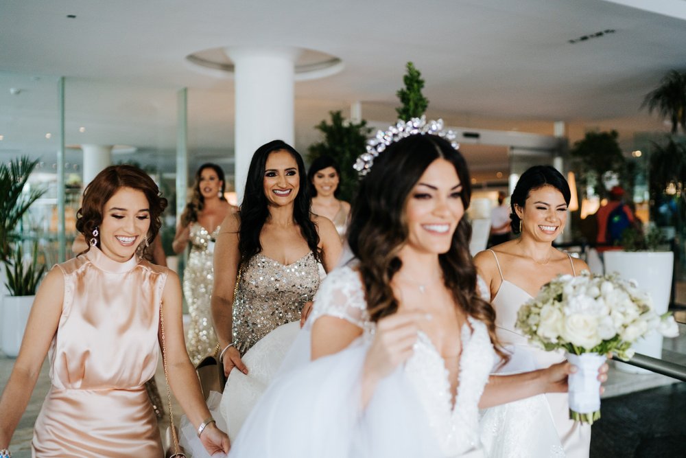 Bride and her bridesmaids leave La Concha hotel for their wedding and are giddy with excitement