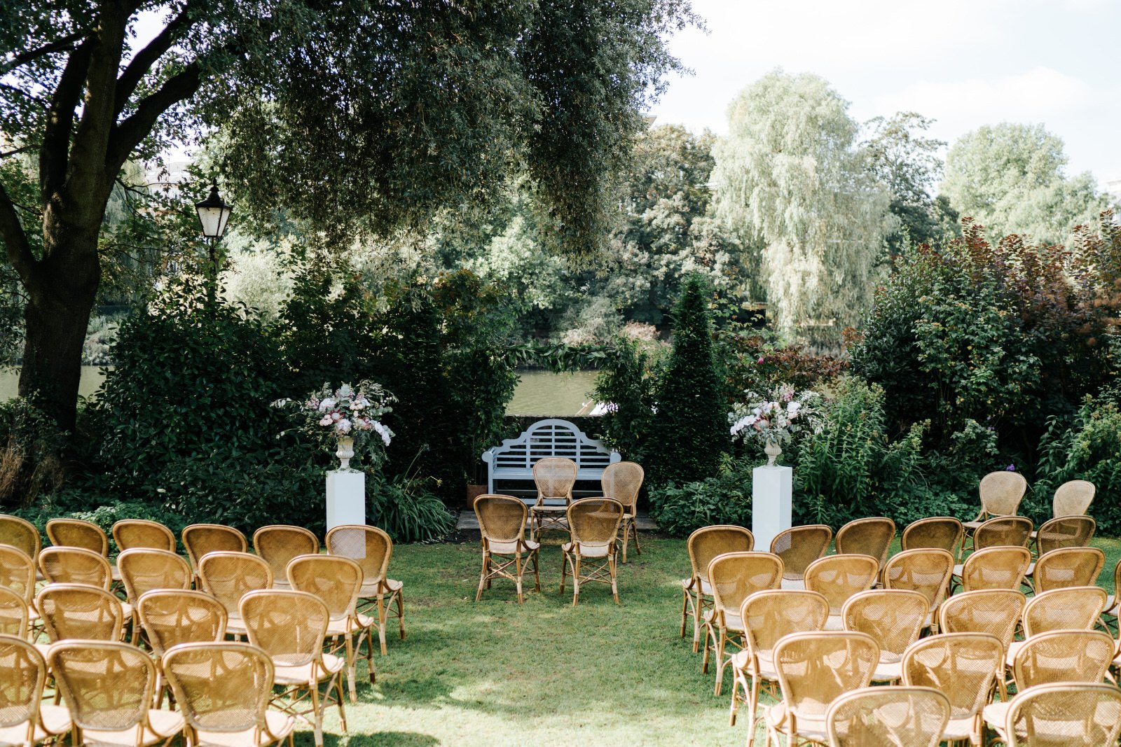 Wide photograph of ceremony area at Bingham Riverhouse including beautiful King Protea flowers by Johanna Pedrick