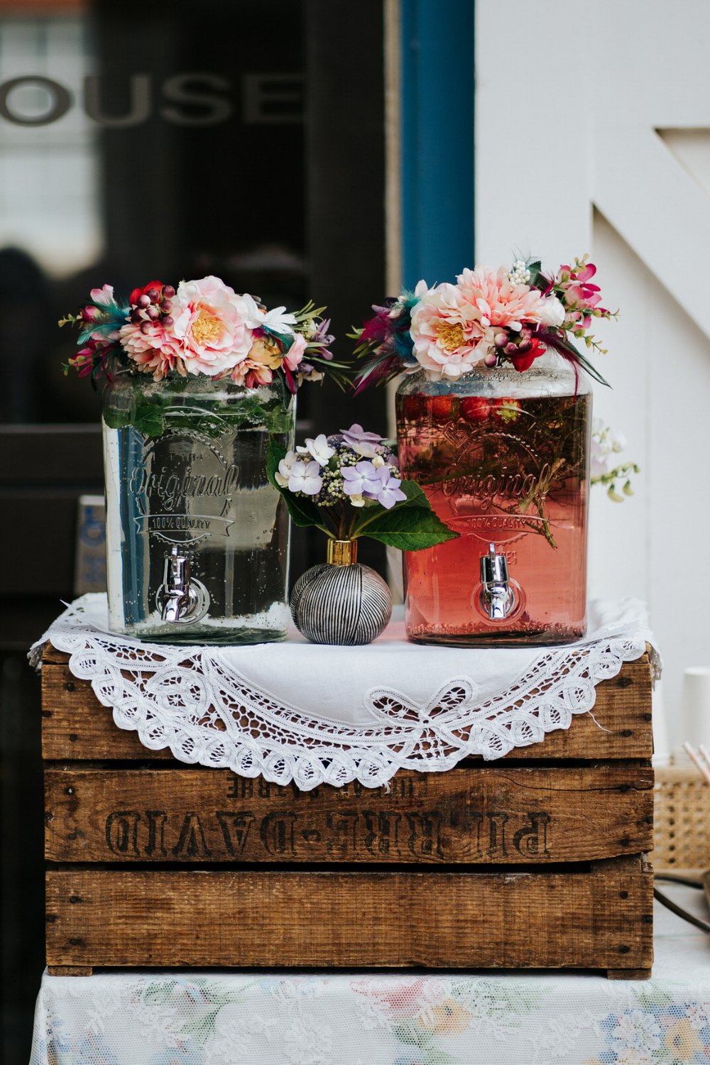Drink jugs decorated with pink flowers by Jessica Eliza in Orleans House Gallery wedding