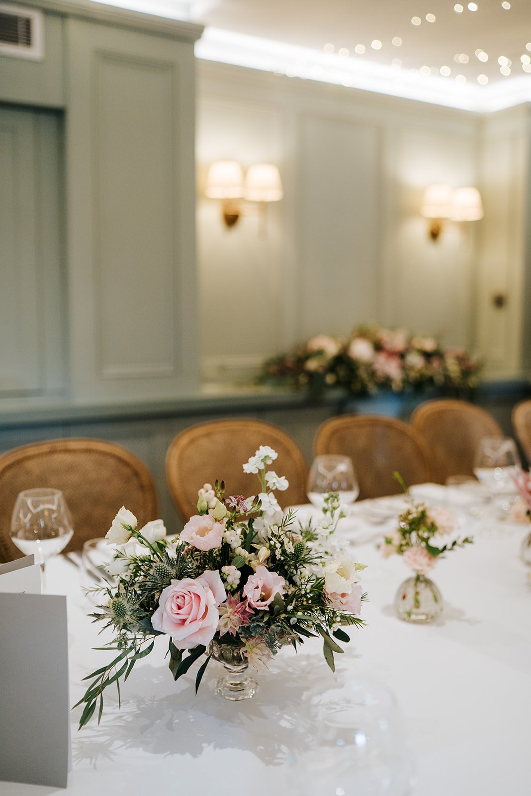 Close-up of pink flowers decorating table put together by Johanna Pedrick 