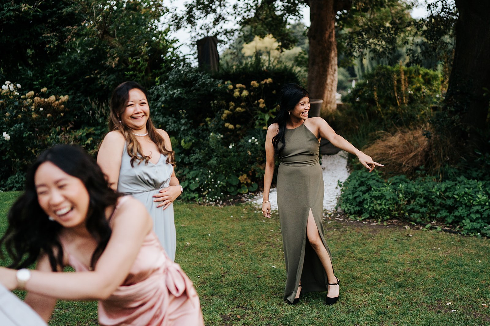 Bride's friends try to evade the bouquet in funny photograph