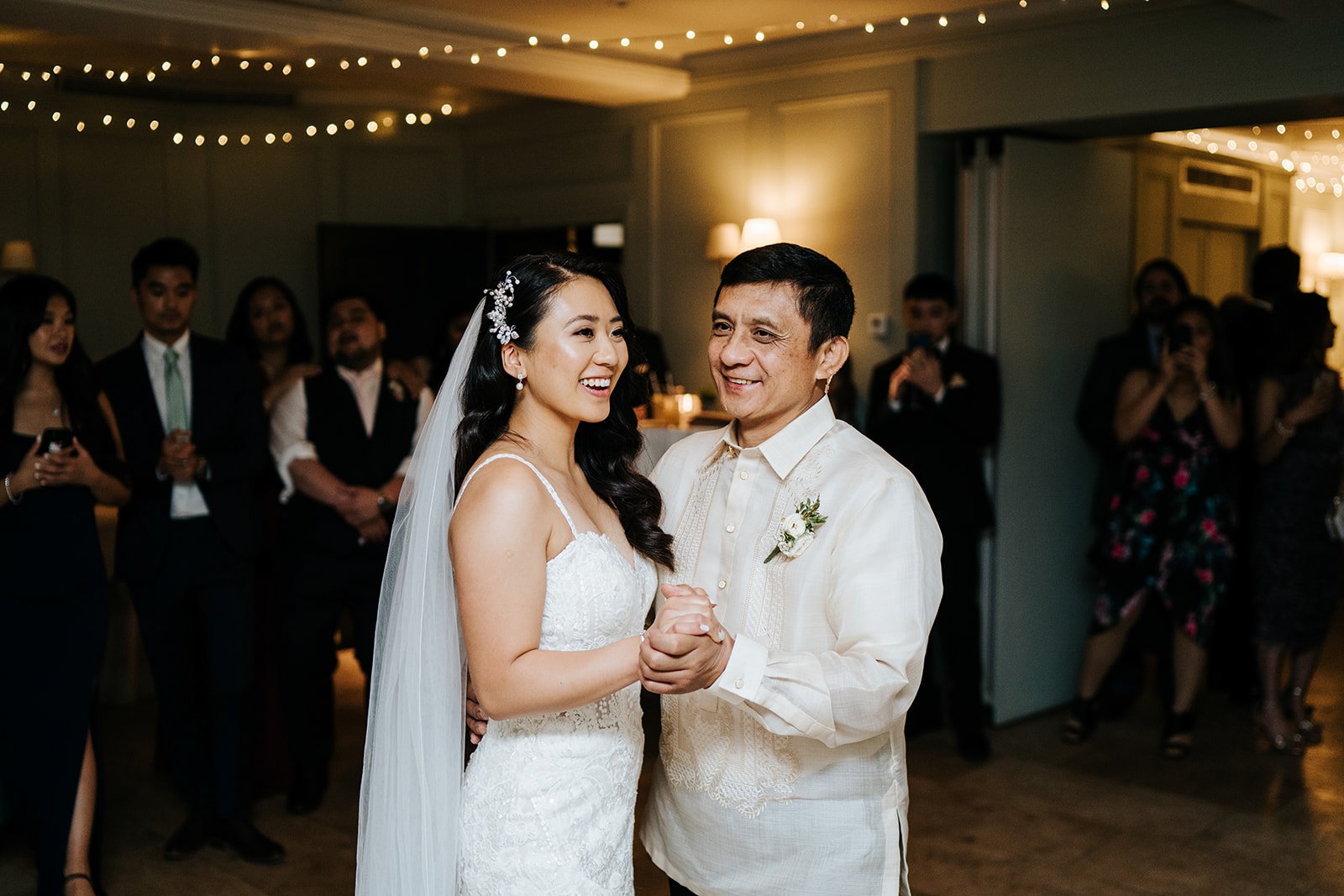 Bride shares a dance with her father as the evening party begins 