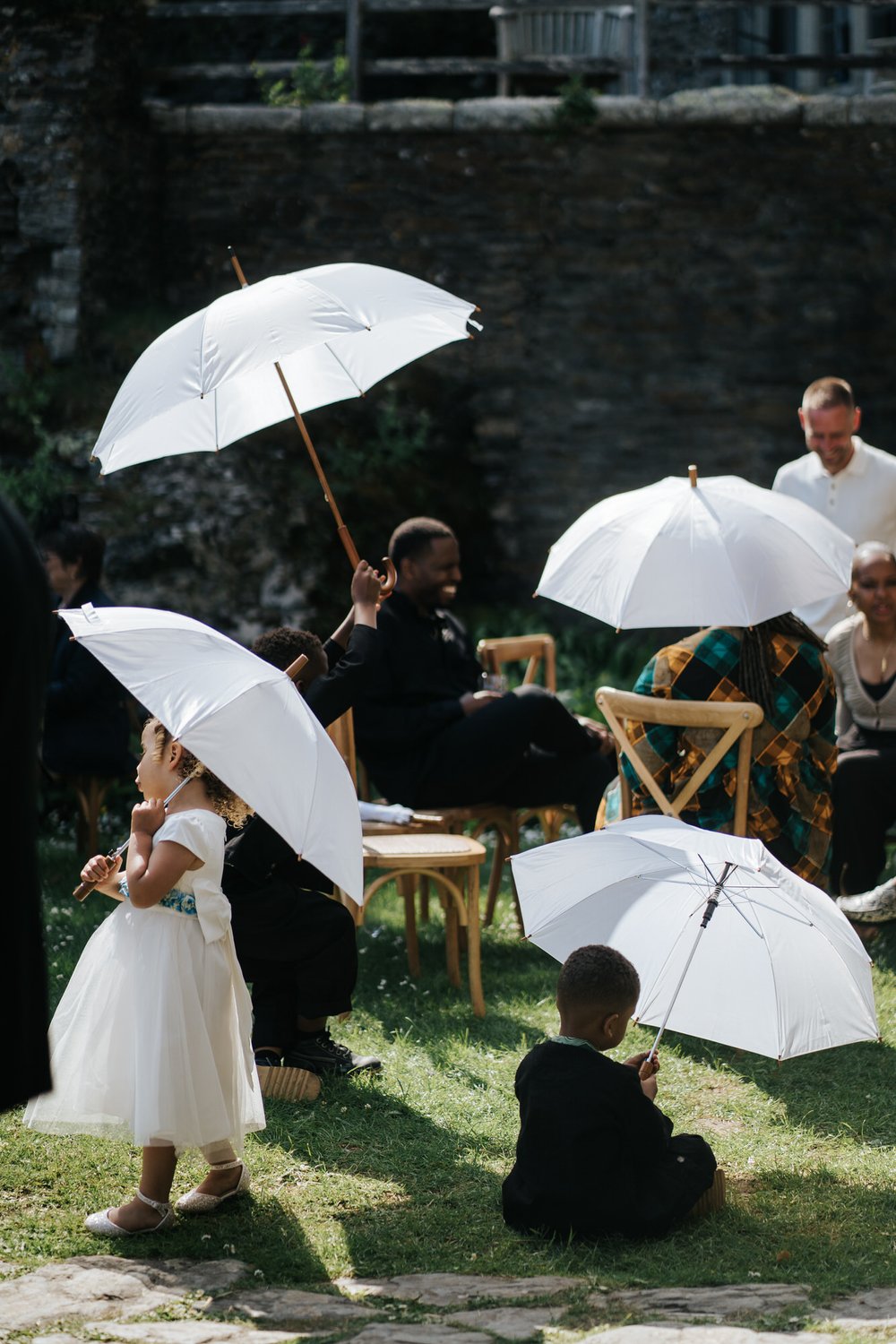 Array of white umbrellas used to shield guests from harsh sunlight create an elegant, accidental display