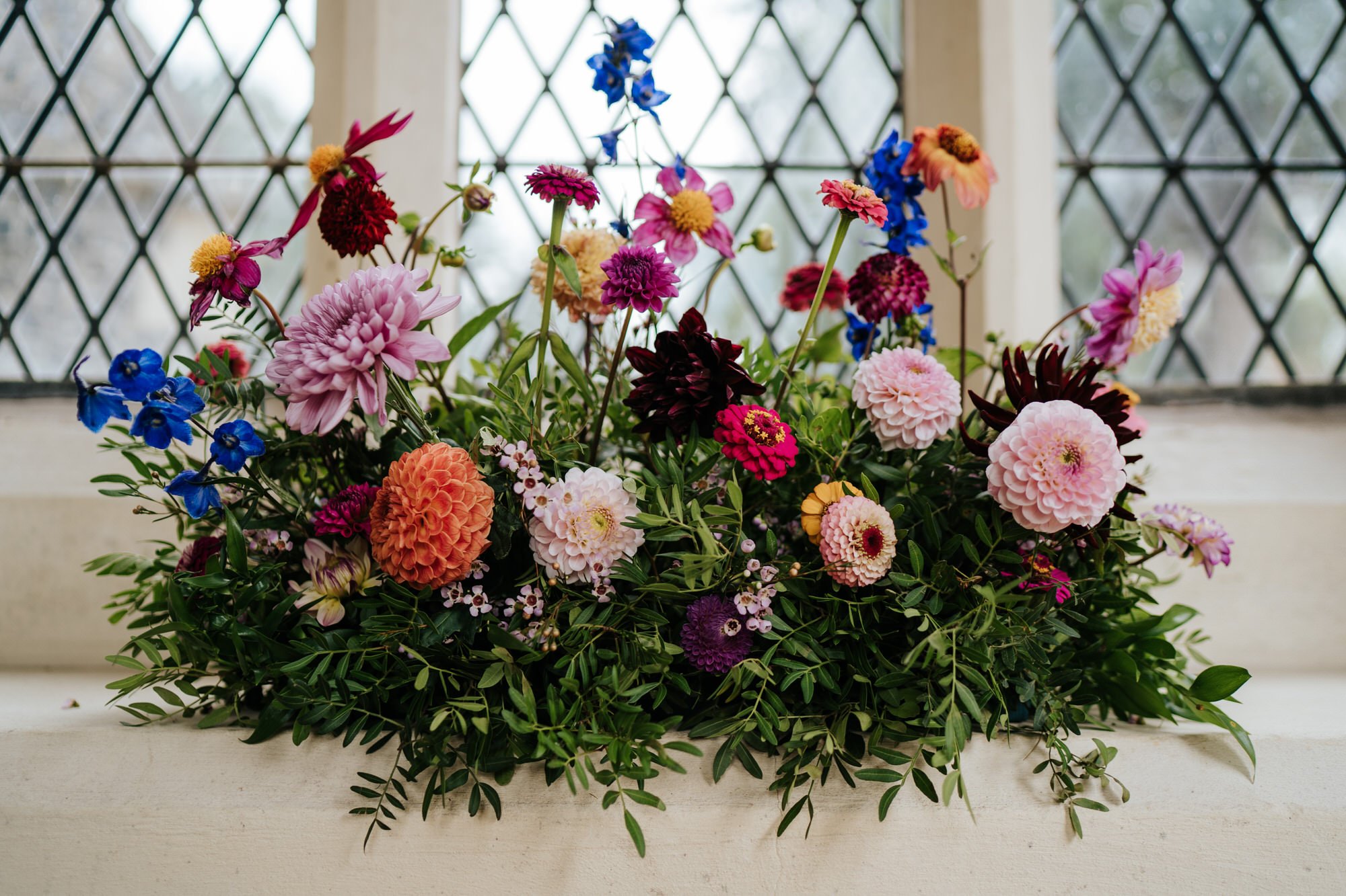 Beautifully colourful red and blue flowers used as decoration during wedding in Woodbridge