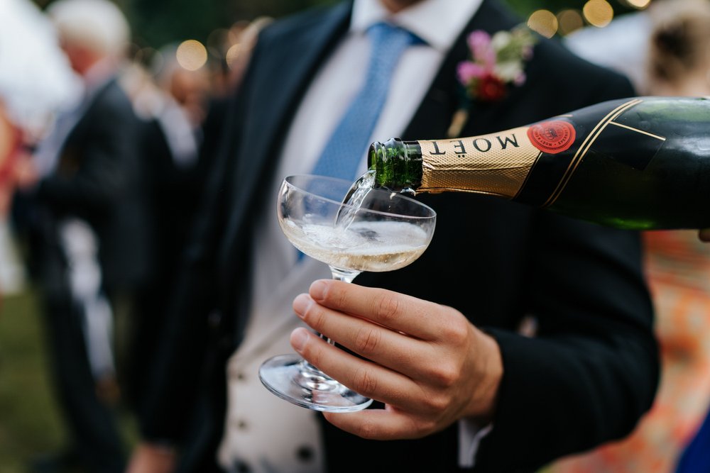 Close-up photograph of Moet being served into a champagne glass