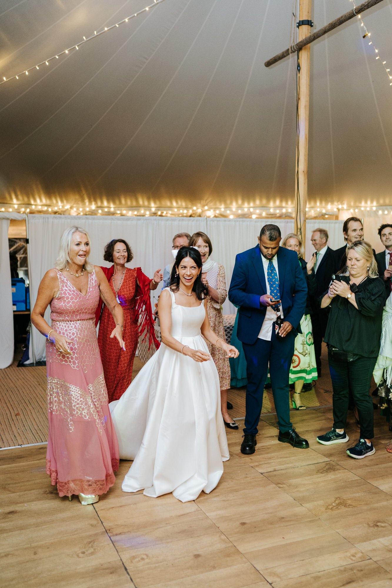 Bride starts approaching the groom so that the first dance can begin