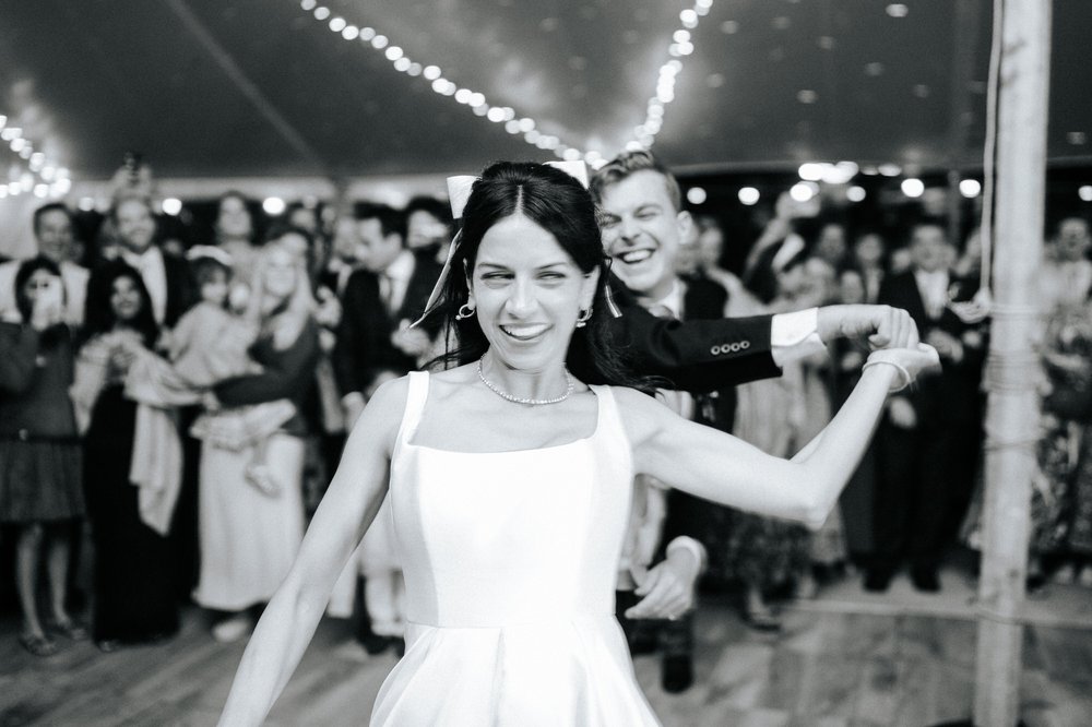 Black and white photograph of bride and groom sharing their first dance
