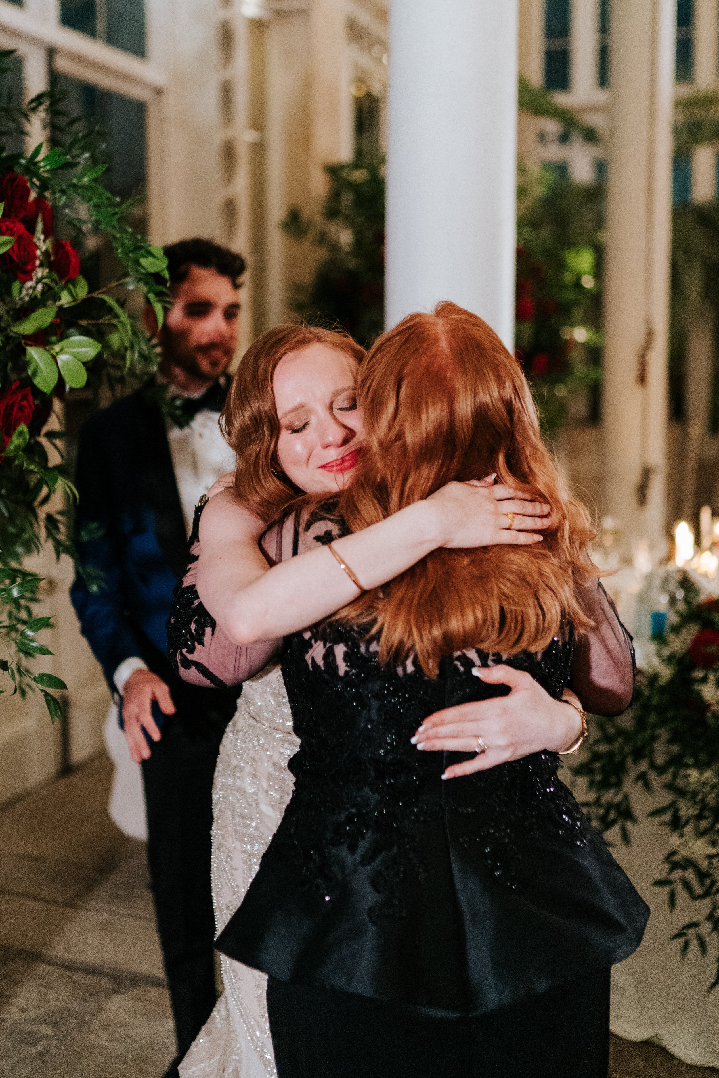 Bride hugs her mother at Syon Park after emotional wedding speech
