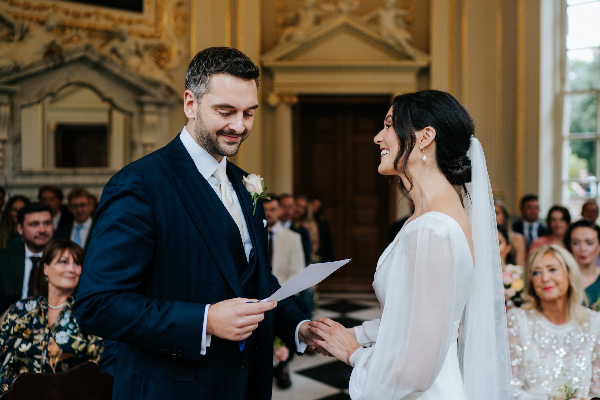 Bride and groom share their vows to each other at Orleans House Gallery wedding as groom has a tear stream down his face