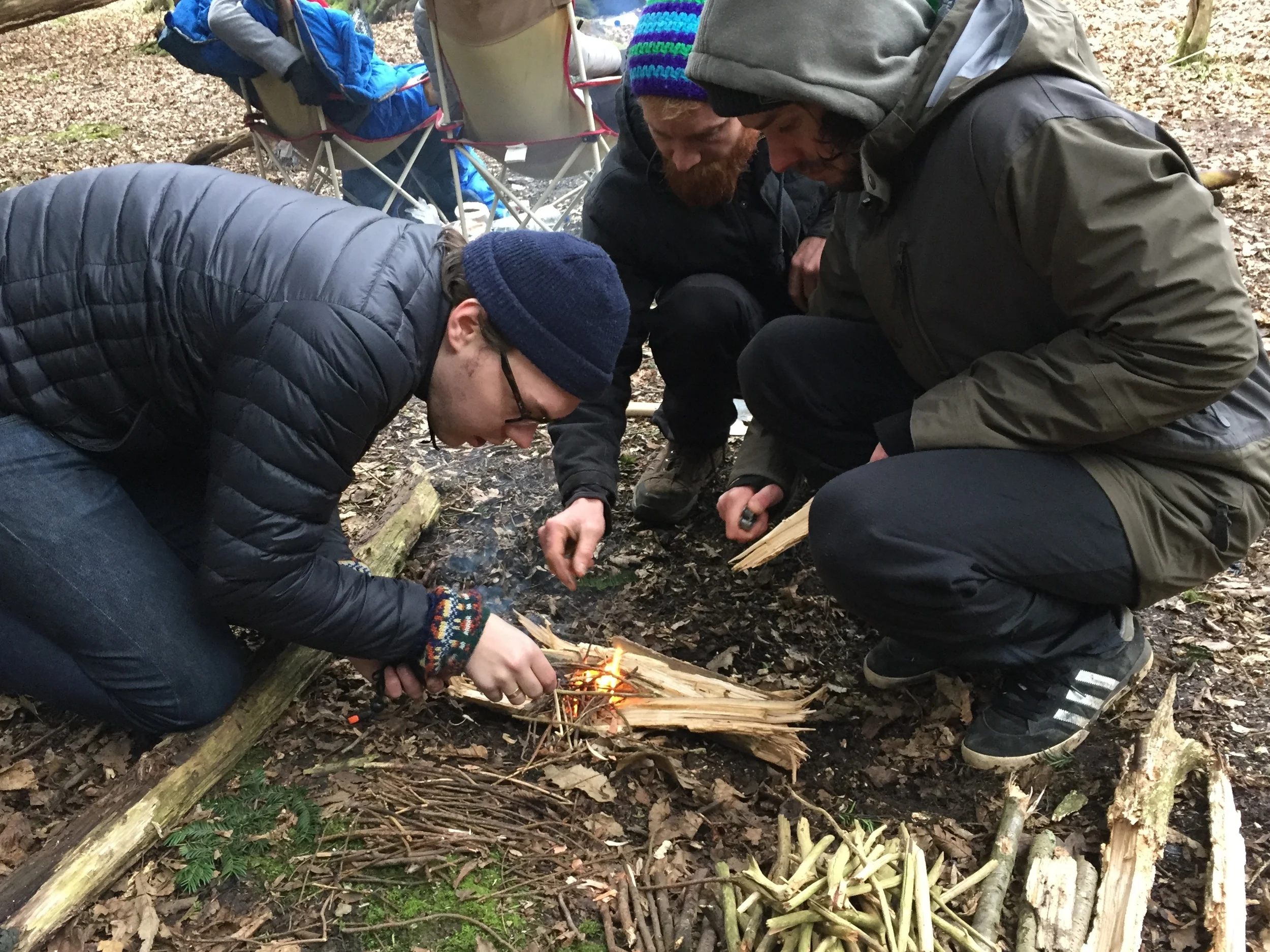 Some of the guys practicing fire lighting.