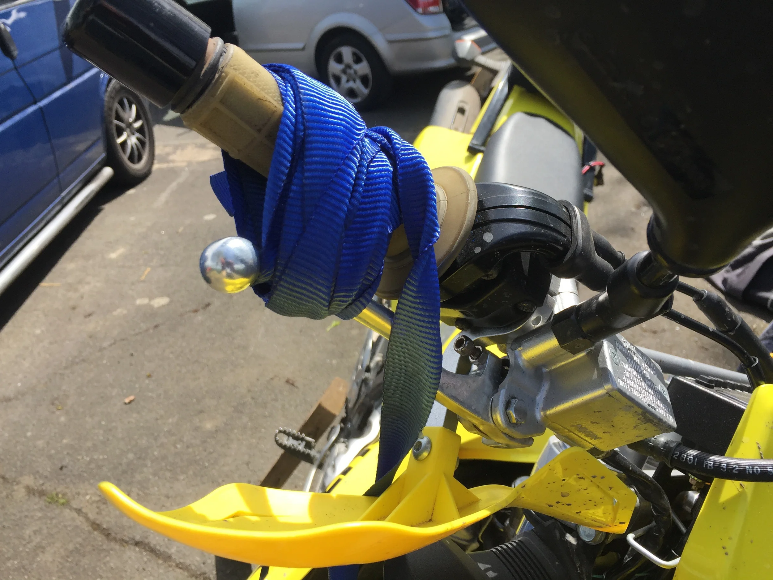 Using a strap to keep the front brake on