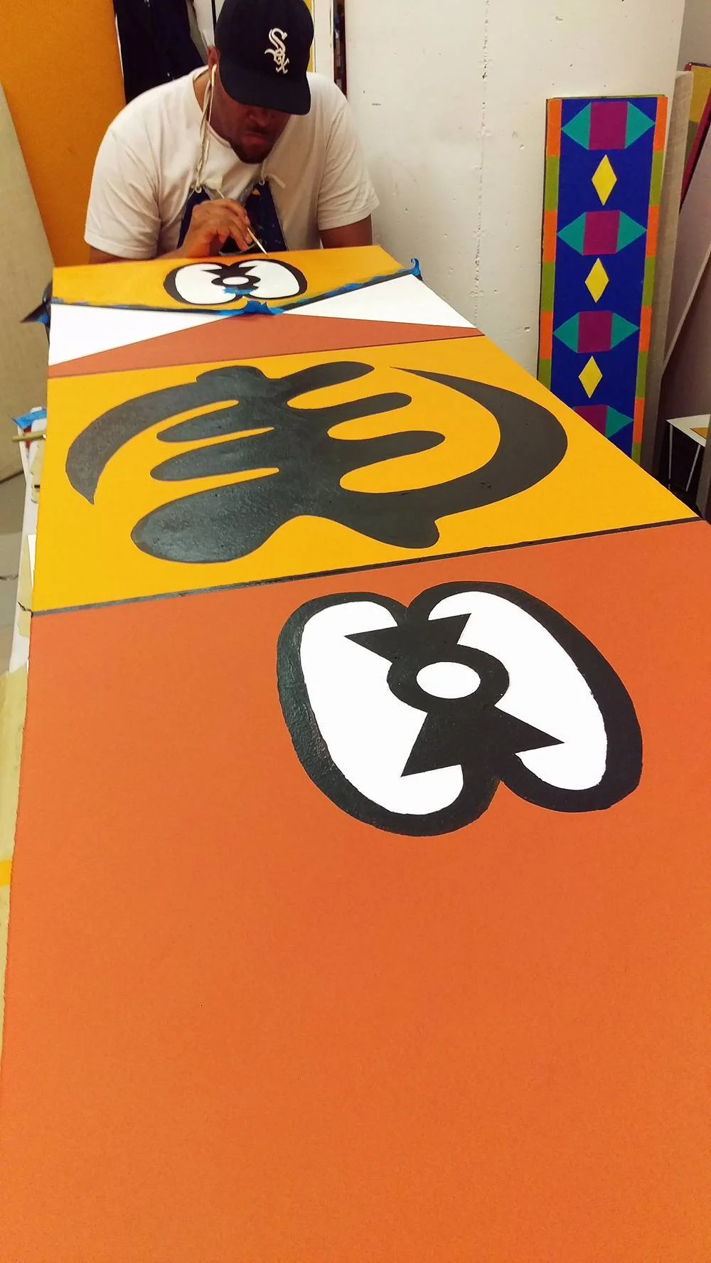 Norwood paints panels for a Drive By Project.