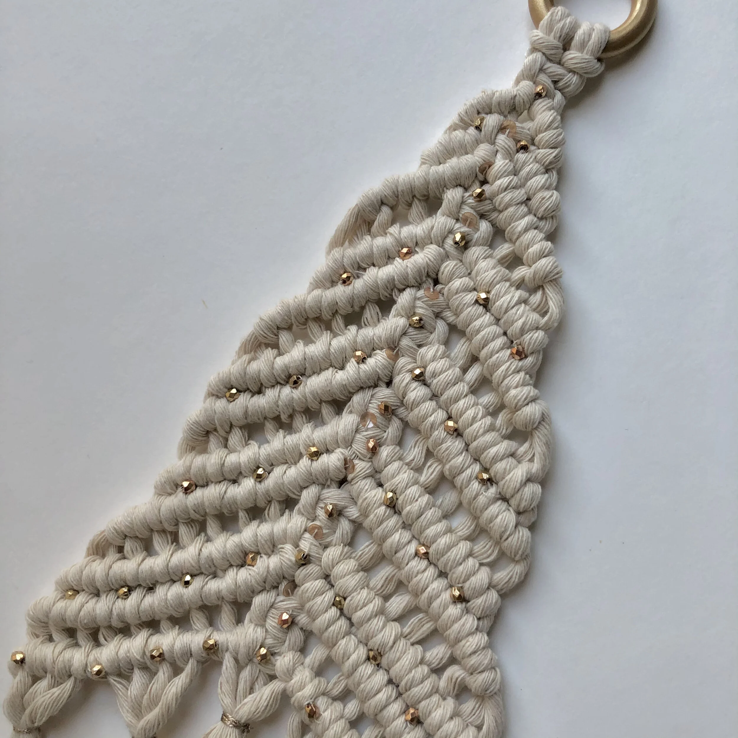 Gold bead and sequin details.