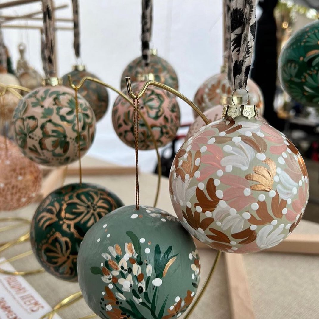 Handpainted holidays ✨✨✨ thanks @craftandmercantile  for capturing my ornaments from last Friday&rsquo;s market in the perfect golden hour light.
