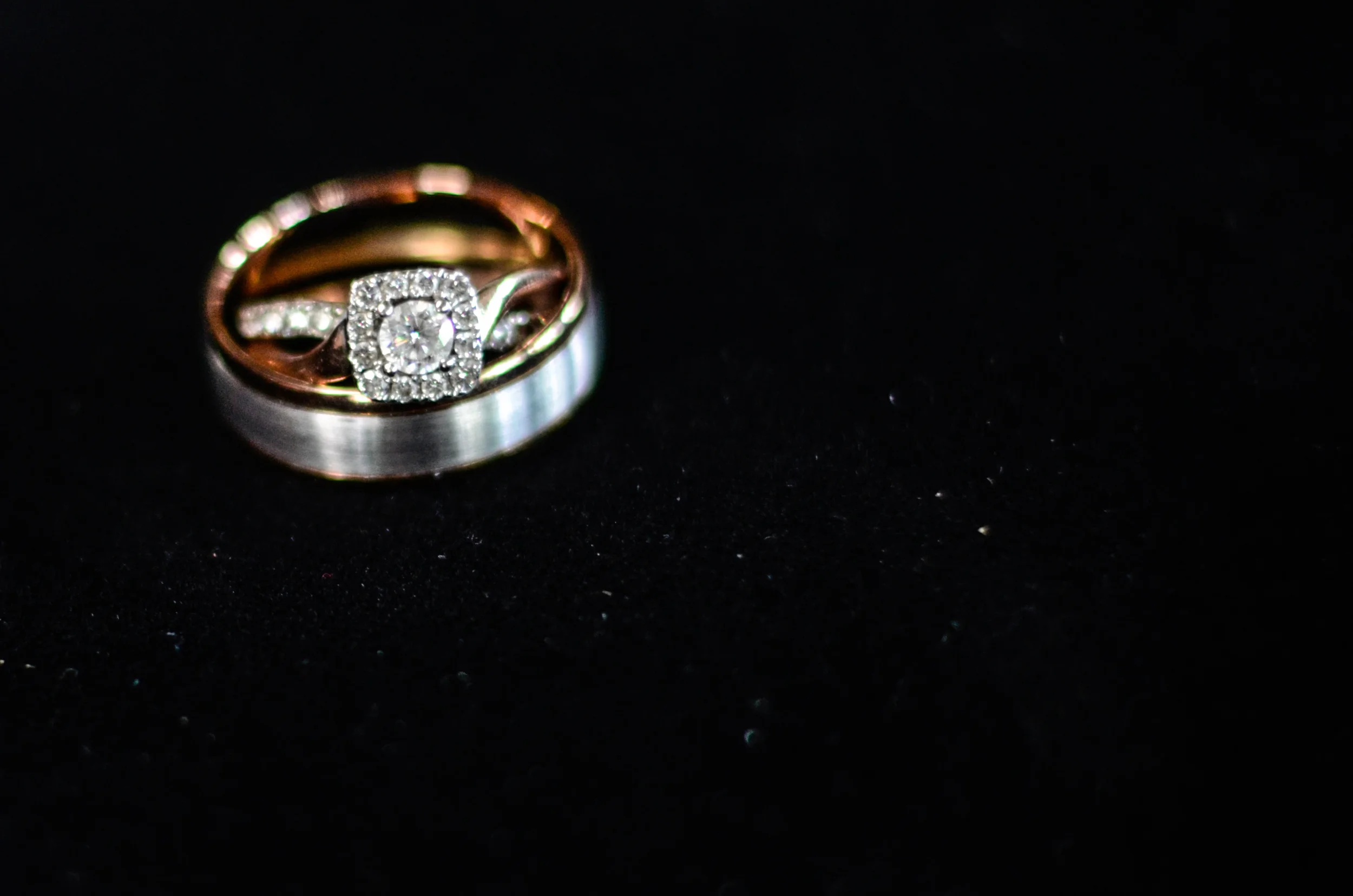 Silver and Rose Gold engagement ring and Groom's wedding band.