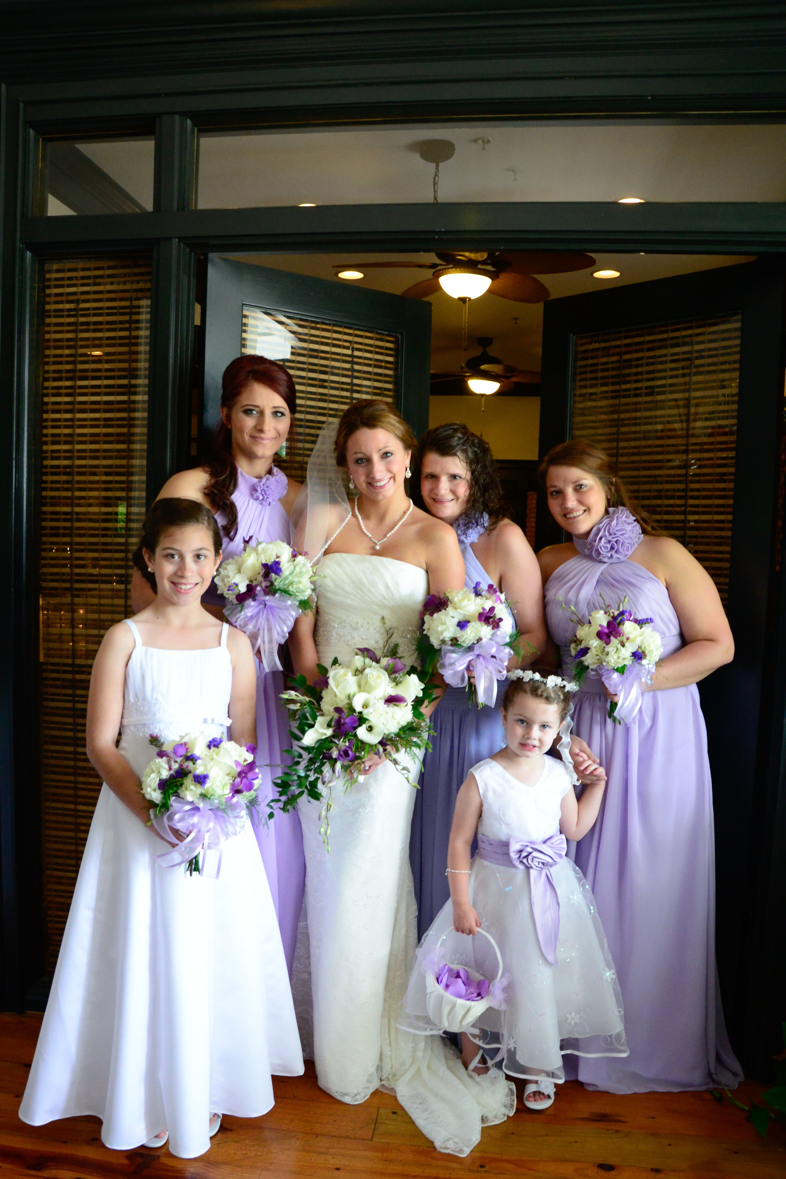 The Bridesmaids were in lilac full length dresses with tropical inspired bouquets by The Floral Case.