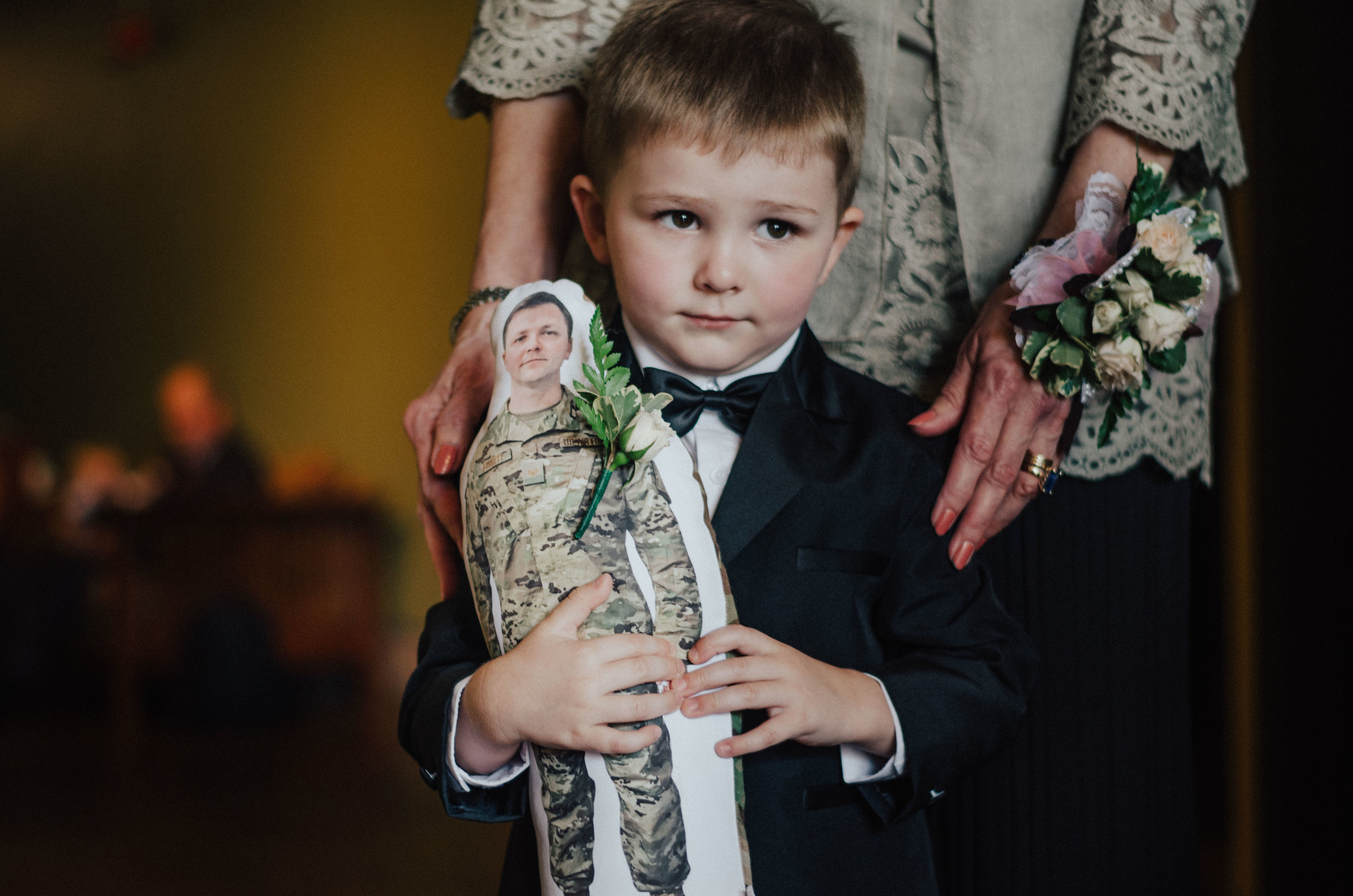 Justin’s brother was deployed during their wedding, so they had this little doll made for his nephew which the little guy carried with him all day. Cue all the tears!