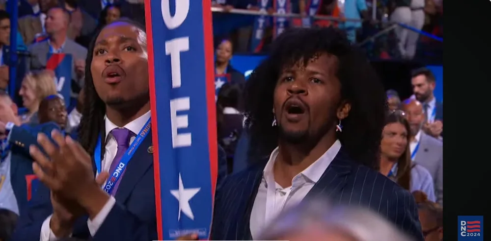 Dr Matt and Malcolm DNC Cheering Obamas 2024.JPG