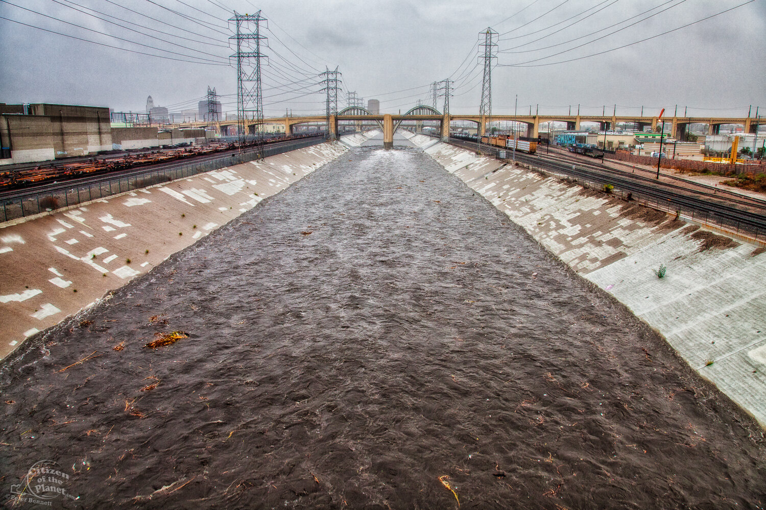  The LA River rises dramatically during a big rainstorm near the now-demolished 6th Street Bridge in downtown Los Angeles. 