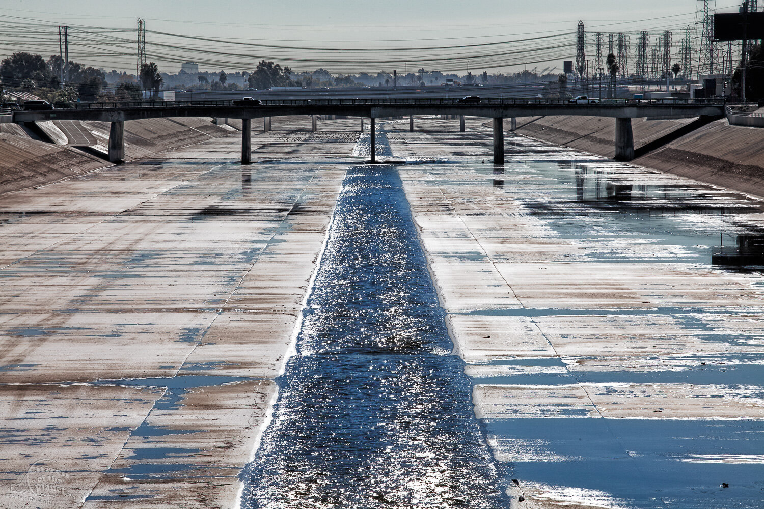  The sun reflects off the river’s culvert in Paramount. 