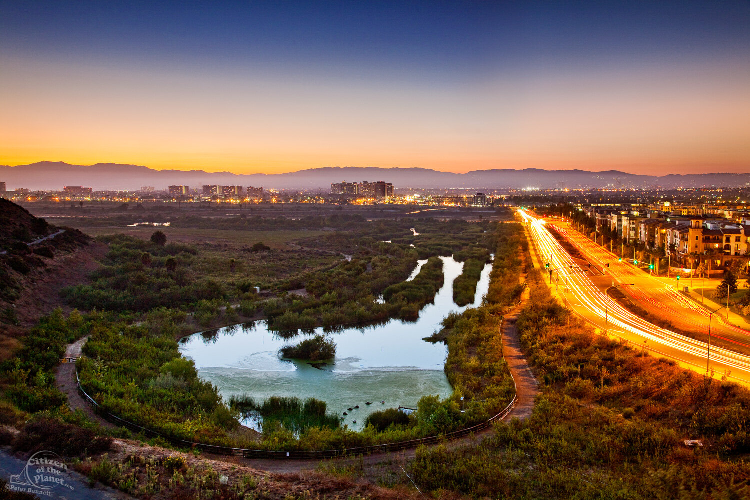  The Freshwater Marsh is at the southern end of the wetlands and borders Lincoln Boulevard and the residential Play Vista Complex. The sun sets over the Santa Monica Mountains in the background. 