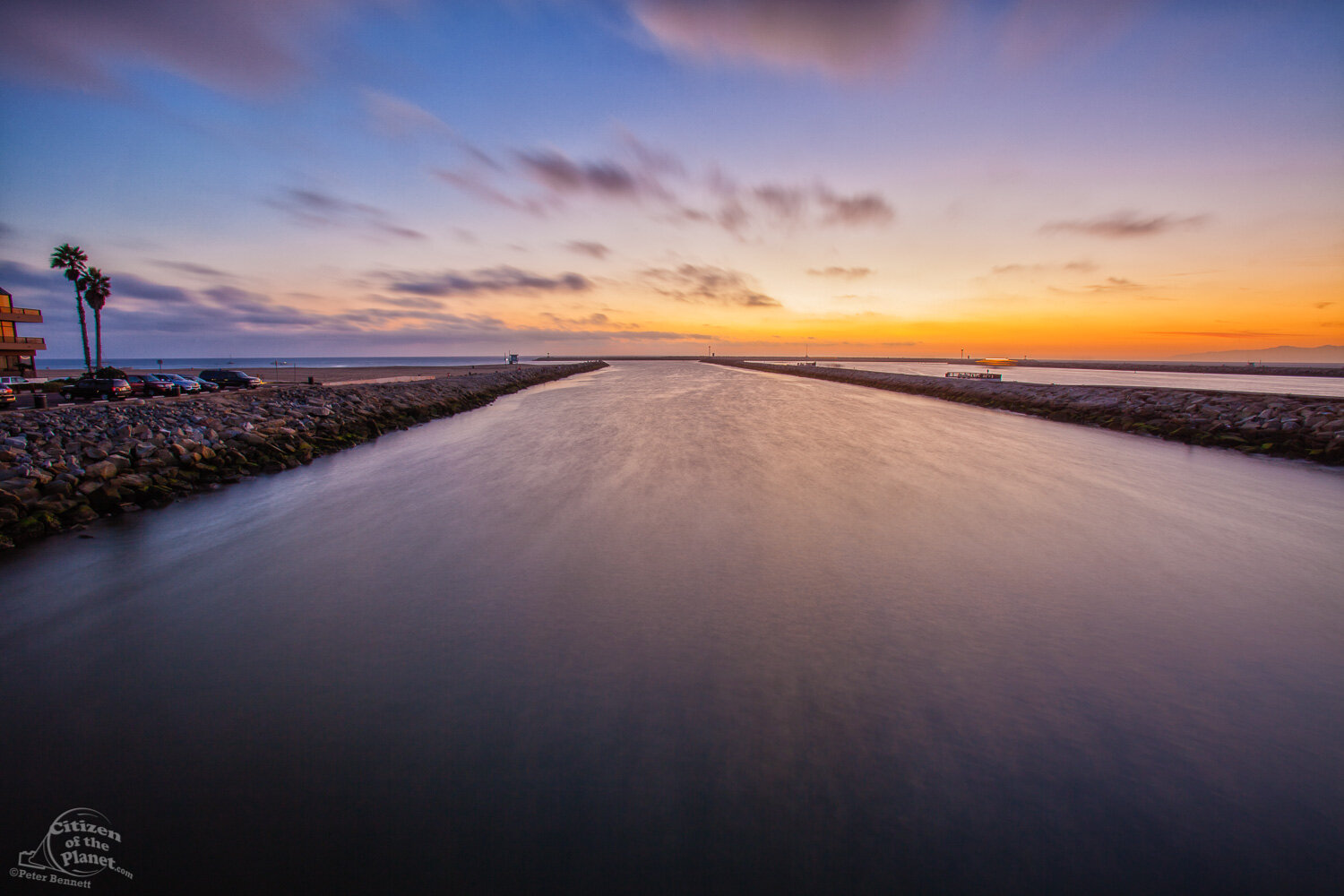  Sunset and the Pacific Ocean greets the waters of Ballona Creek at it’s mouth in Marina Del Rey. 