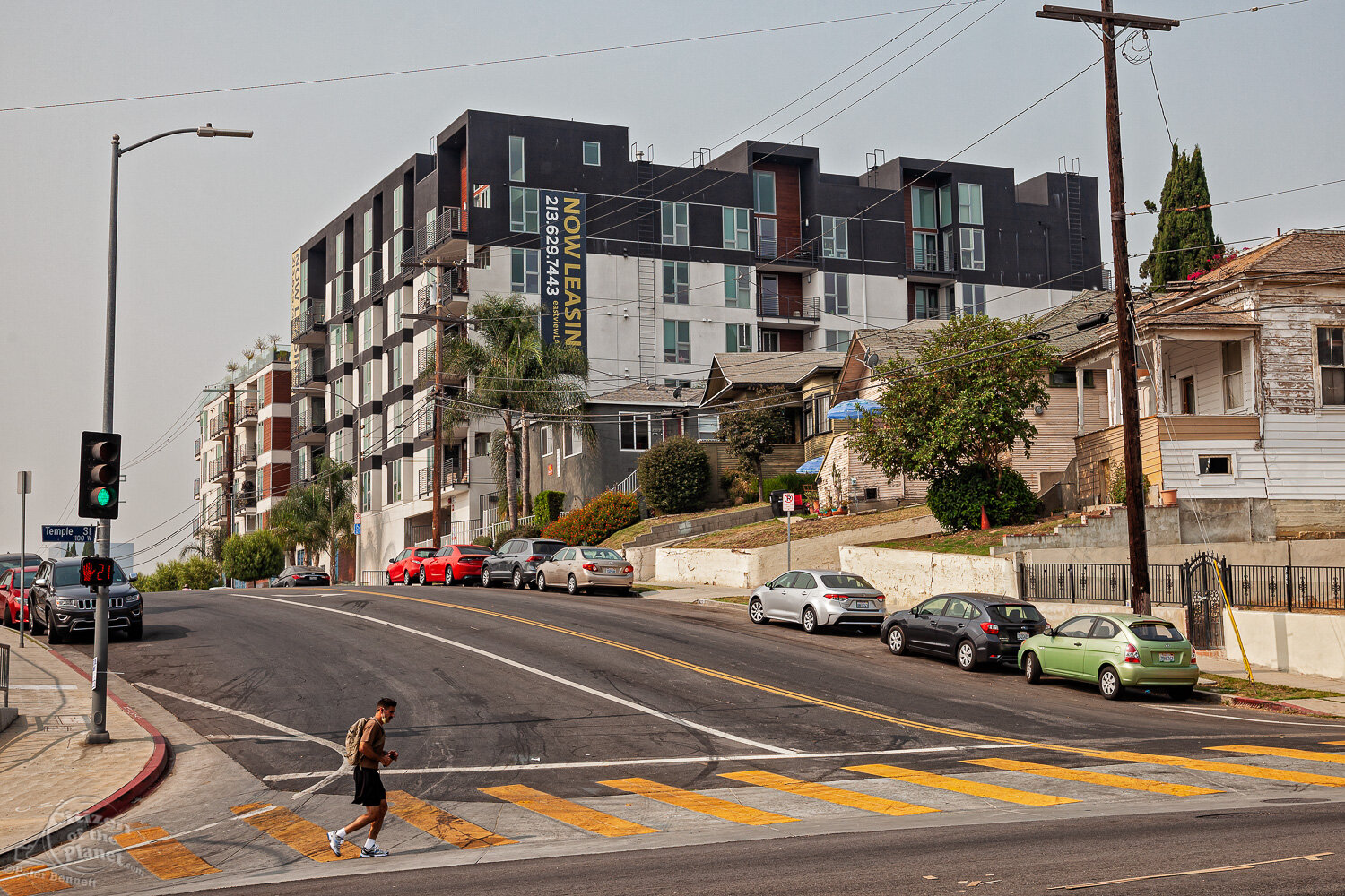  A “Now Leasing” sign hangs from a recently constructed multi-unit residential development along Boylston Street next to some of the original single-family homes common to the area. Vista Hermosa is a neighborhood near downtown Los Angeles that sits 