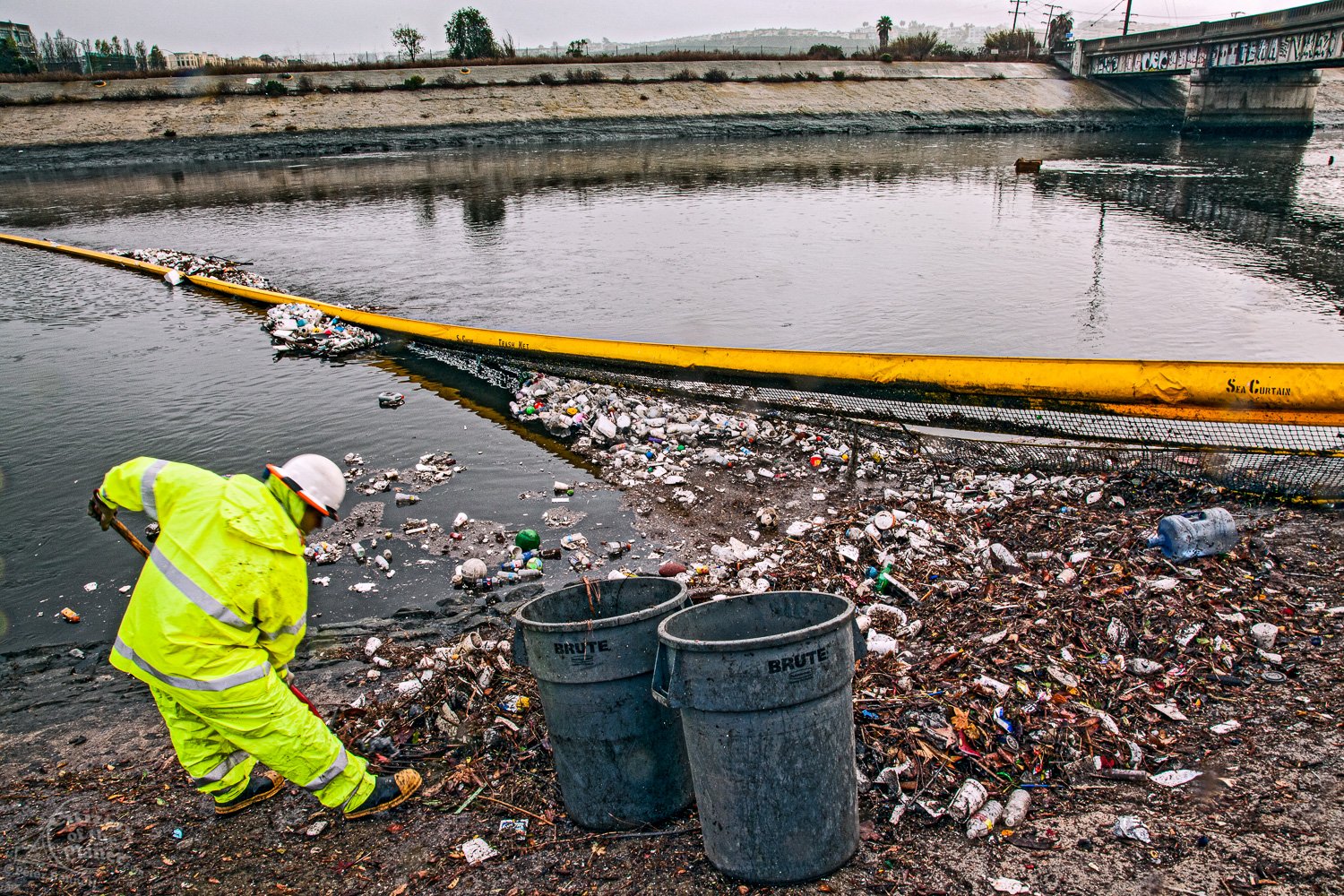  Department of Public Works workers clean up garbage that accumulates in Trash Net boom at the mouth of the Ballona Creek after first rainfall of the year. 