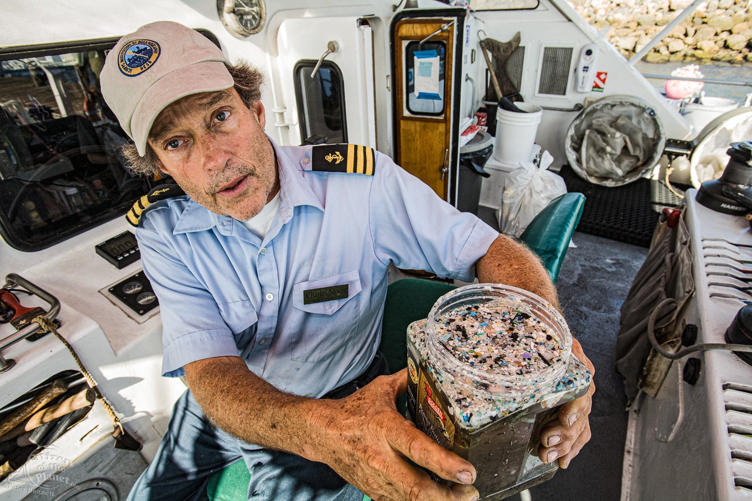  Captain Charles Moore holding jar of micro-plastics he trawled from a recent trip through the North Pacific Gyre. 