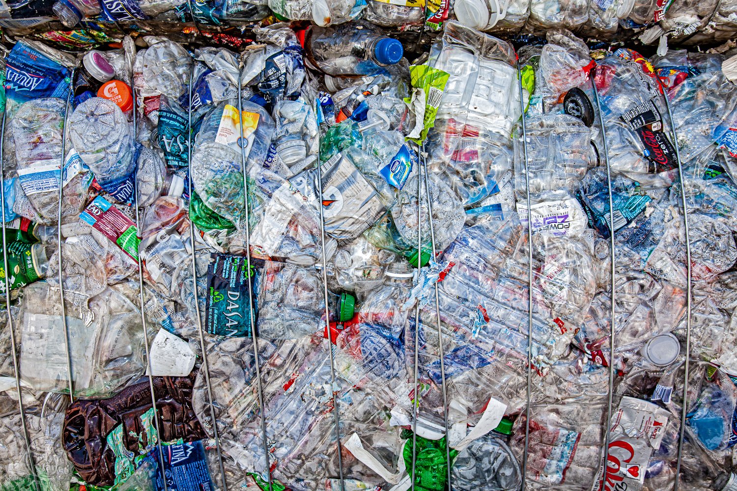  Stacks of Polyethylene terephthalate (PET or PETE) bottles, at a Recycling Center 