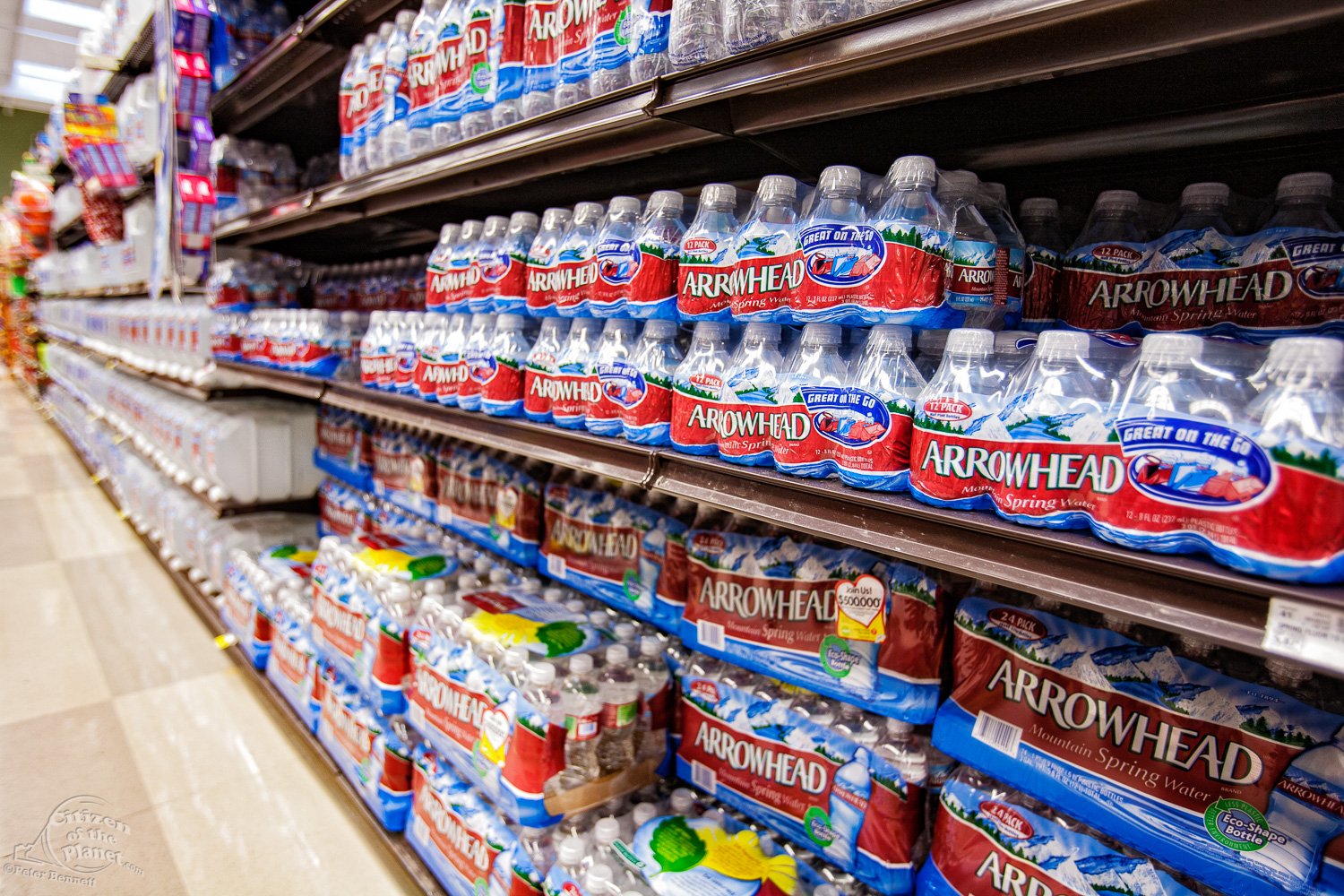  Plastic water bottles on shelves of supermarket, Los Angeles, California, USA 
