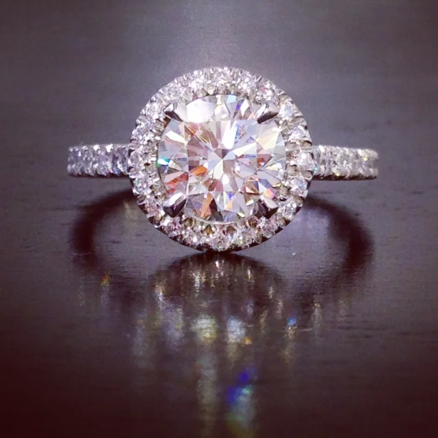  Custom, platinum, euro-pave, halo ring with 1.64&nbsp;ct., round brilliant cut center. 