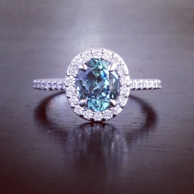  Custom, oval, halo ring in 14k w.g.&nbsp;for customer's blue sapphire. 