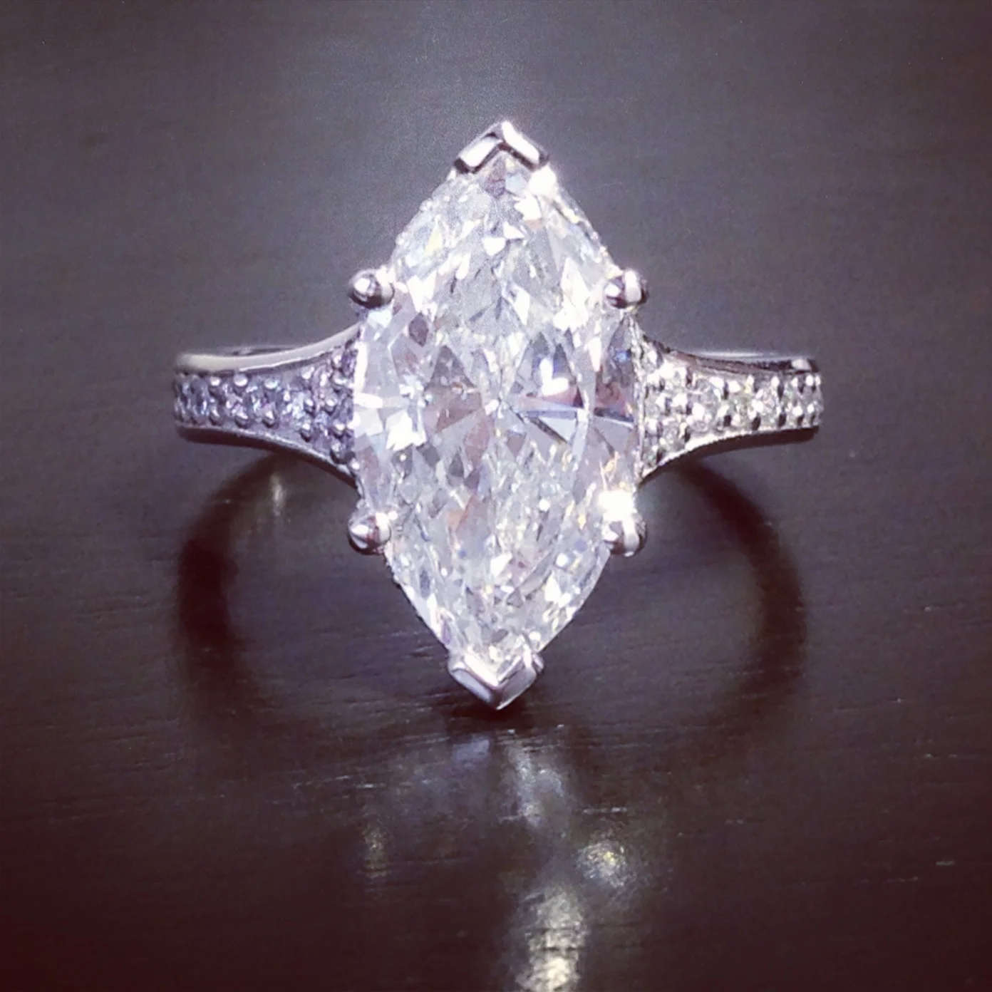  Platinum, pave, diamond ring with 3.00 ct. marquise cut center. 