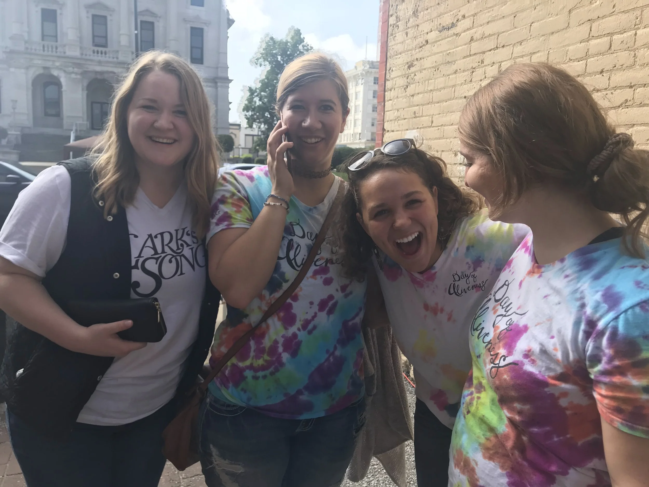 Emily chairs the committee for Lark’s Song’s Day of Aliveness each year. Pictured here (L—>R) Aubrey Baker (cohort 12), Emily Hathway (cohort 1), Brenna McCarty (cohort 9), Jami Taylor (cohort 2) worked together with other LSCCs and members of our community to co-create this incredible event.