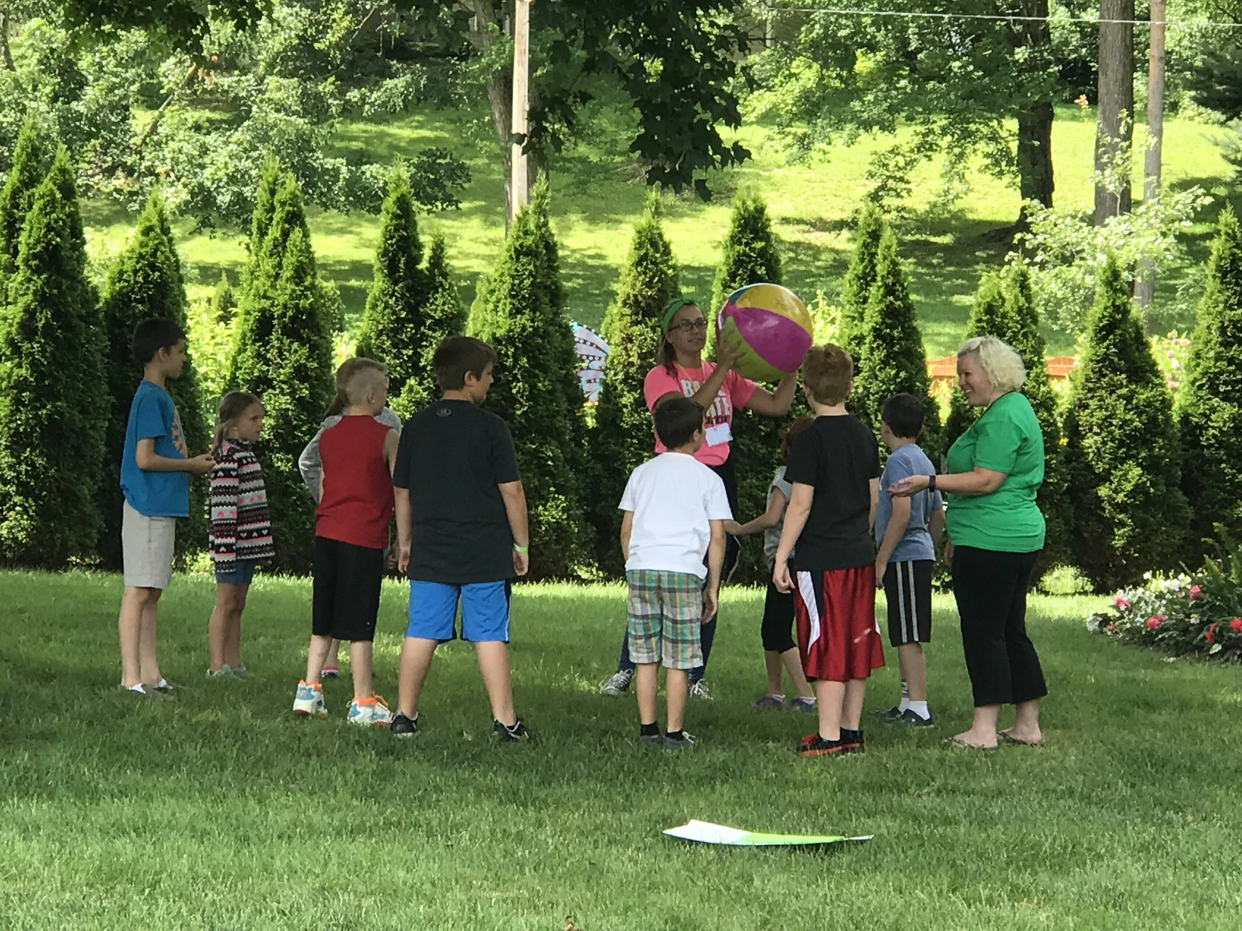 Erica leading the Green Team at Superhero Camp in Matter Park.
