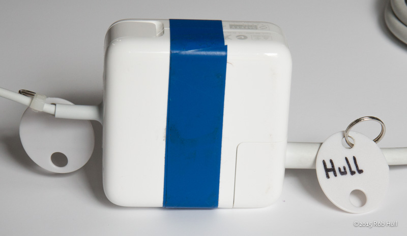 A nice bright piece of tape on an adapter helps ensure it's not mixed up with someone else's gear. Key tags help too.