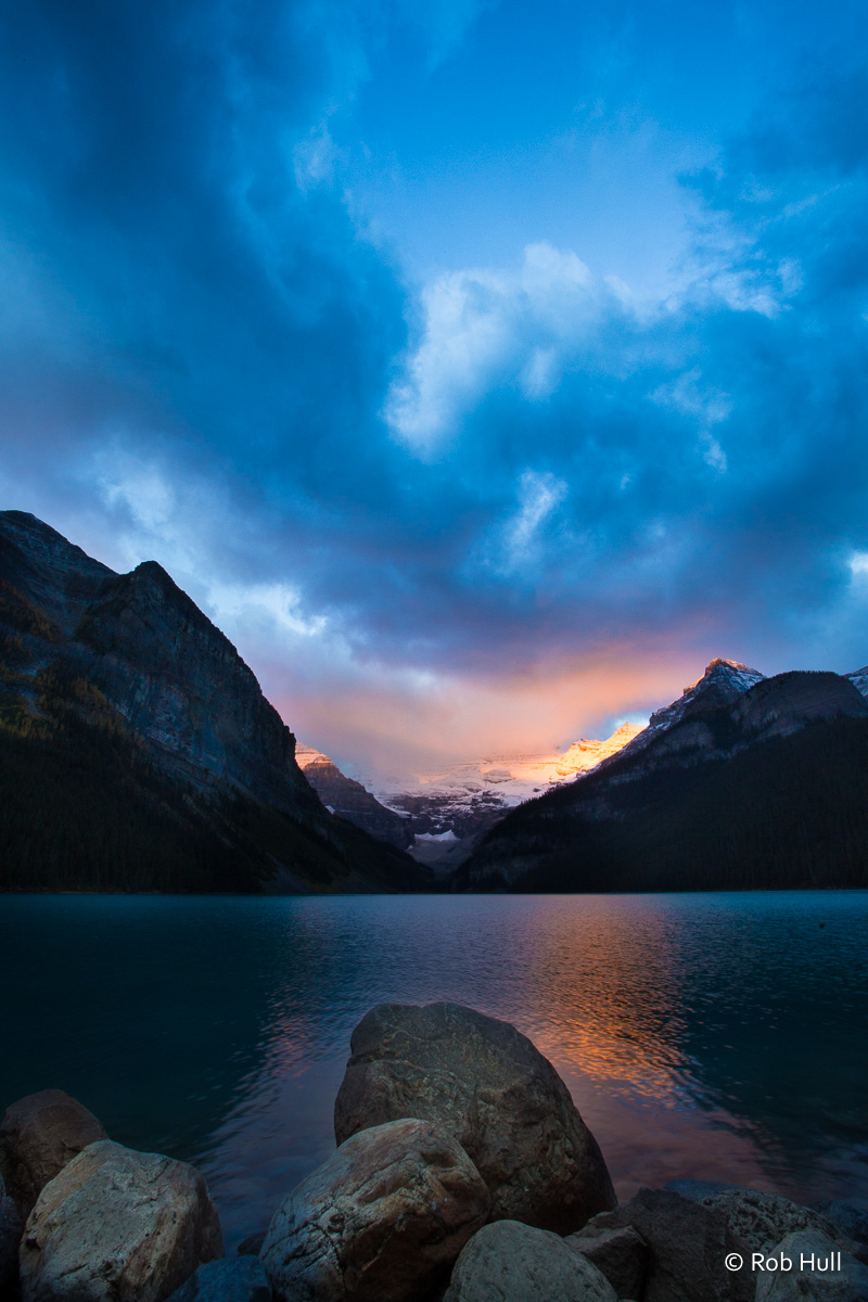 Sunrise on Lake Louise in Banff National Park, Canada. The morning was quite cold and a heavy overcast. The morning light was able to peek in for just a couple minutes before the clouds covered it once again. 