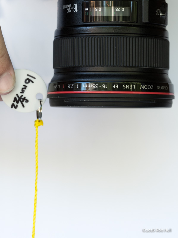 Using your handy dandy hyperfocal string, set your focus to the hyperfocal distance by holding the string at the end of the lens at a point when the fishing weight just touches the ground. Use autofocus to set the focus point at the hyperfocal distance. 