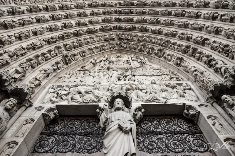 The archway over the doors at Notre Dame De Paris.