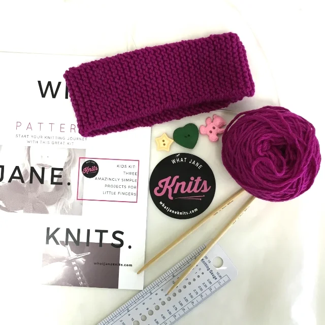 Finished headband and contents of knitting kit
