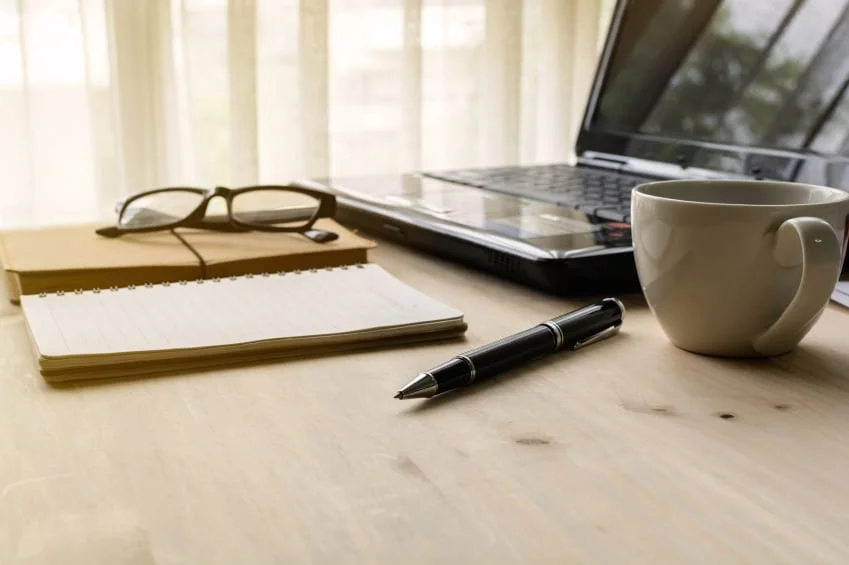 Business management laptop and coffee Photo by FarukUlay/iStock / Getty Images