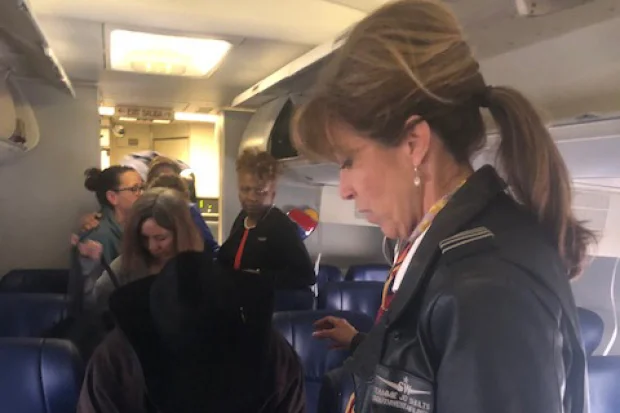 Photo of Southwest Airlines pilot Tammie Jo Shults, right, speaking to passengers after Flight 1380‘s emergency landing in Philadelphia by Diana Self.